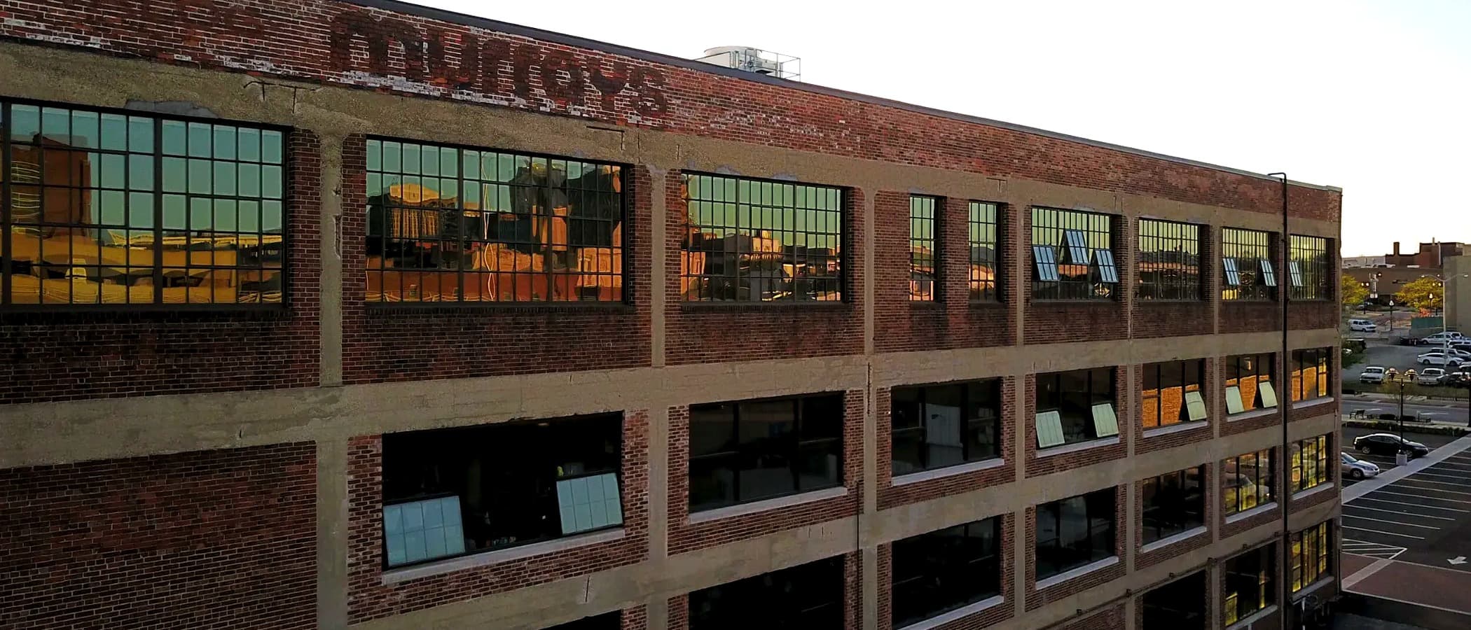 Exposed brick and factory windows at Murray Place Suites